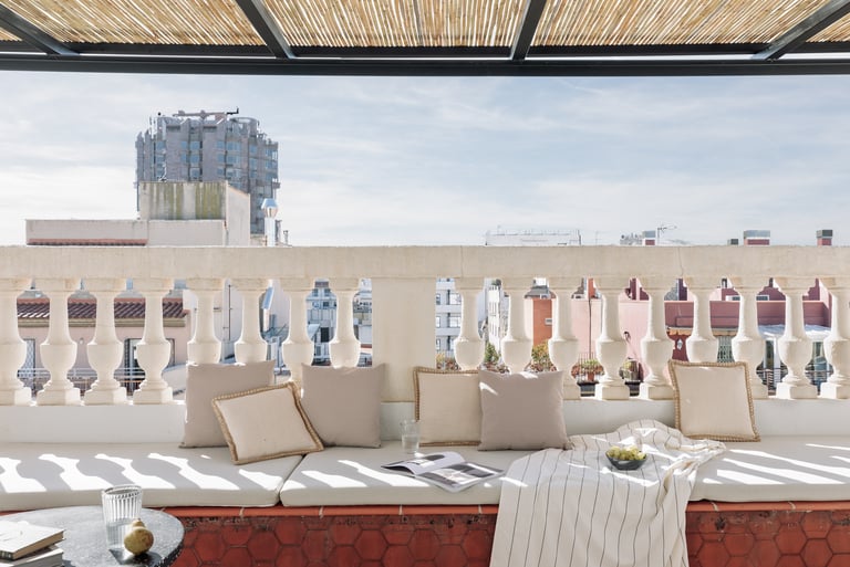 Sunny private terrace with elegant decor and views in Barcelona apartment