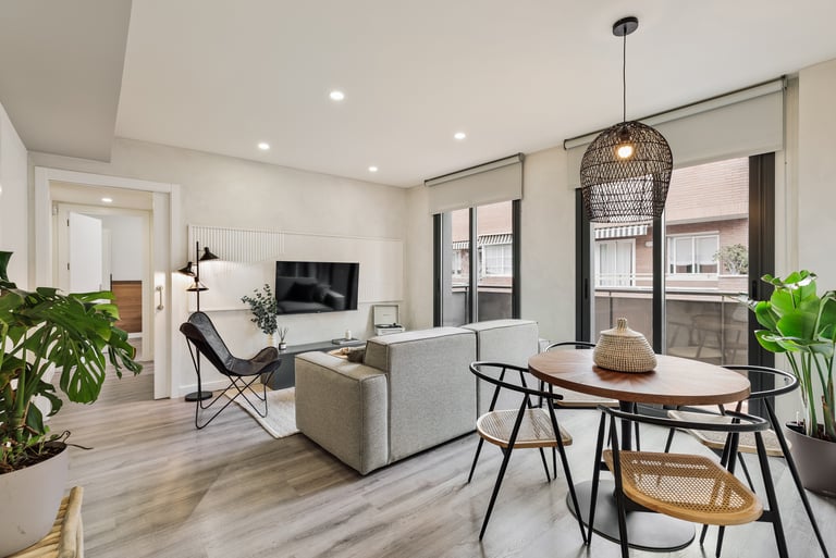 Bright living room with contemporary interior design, bespoke wall panels and black metal accents