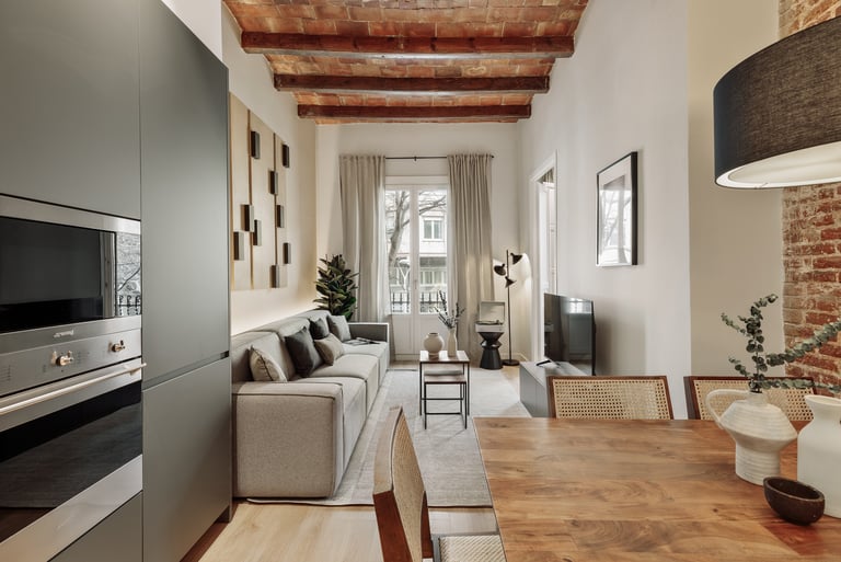 Living room with exposed brick ceiling, wood table and a mix of modern and rustic design
