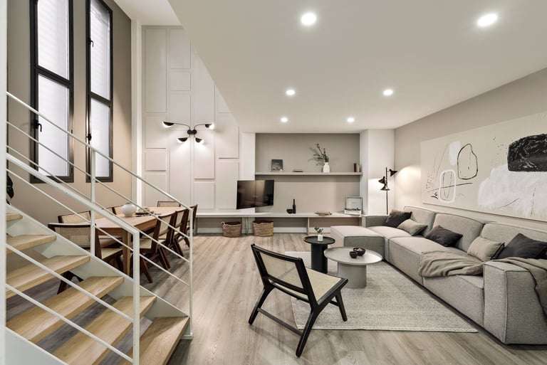Contemporary living room with a minimalist design, subtle lighting, neutral colors in Barcelona
