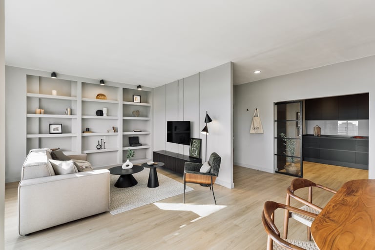 Modern living room interior design with neutral grey tones and black metal accents