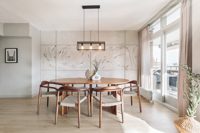 Modern dining area with metal light fixture, wooden dining table and minimalist design in Barcelona