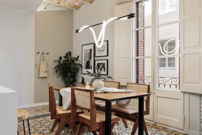Modern dining room with exposed brick walls, tile floors and Catalan vaulted ceiling interior design