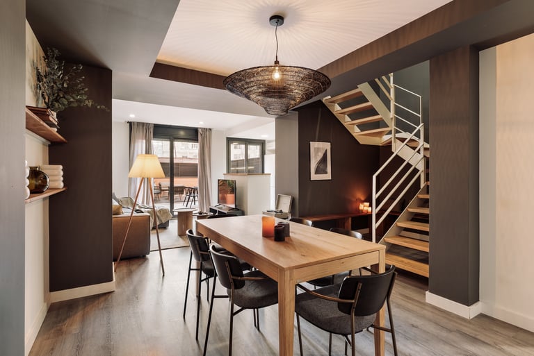 Stylish dining area with contemporary furniture, neutral tones, and a cozy interior design by SAVIA 