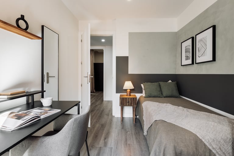 Elegant bedroom with artistic painting, calm color palette and modern minimalist design in Barcelona