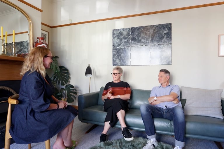 a couple talking to a woman