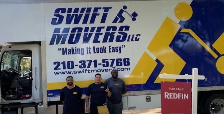 Three Swift Movers standing in front of moving truck, ready to assist with partial packing services