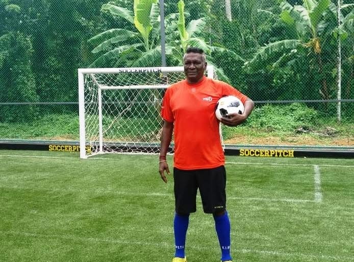 Legendry footballer I M vijayan at Green synthetic football ground with net fencing in edappally