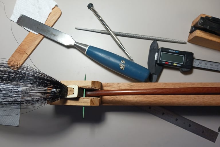 Rehairing a bass bow with black hair