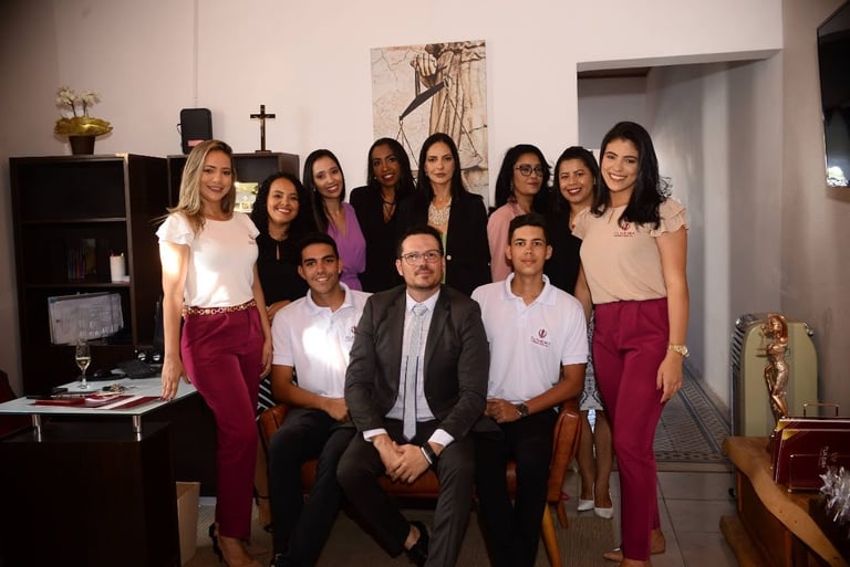 a group of people standing around a table
