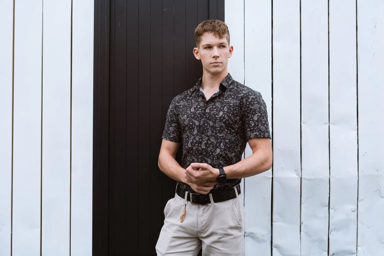 Portrait photo of a young man in an industrial black and white environment