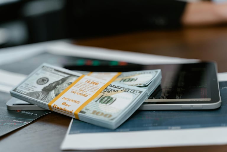 bunch of money and investing charts and graphs