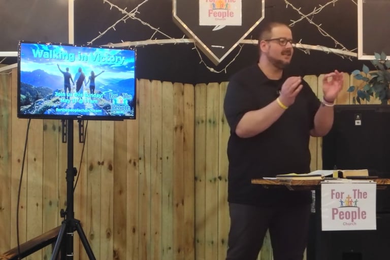 pastor Daniel preaching on "walking in victory"