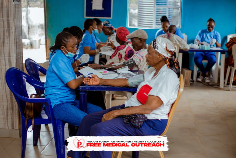 Image of volunteer nurses attending to participants, checking blood pressure