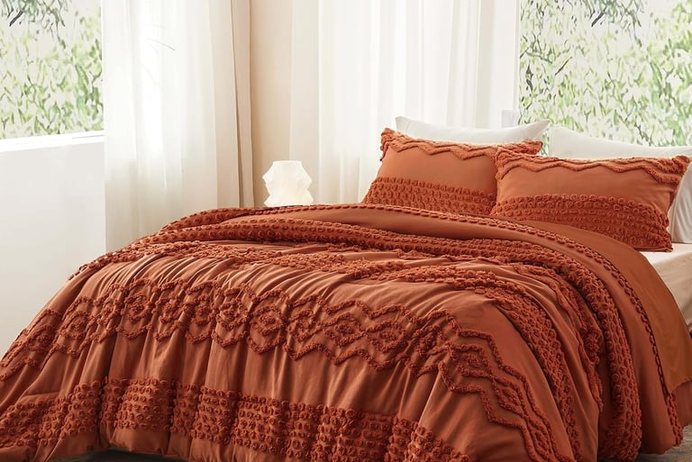Tufted terracotta duvet cover set with textured geometric embroidery in a bright, modern bedroom.