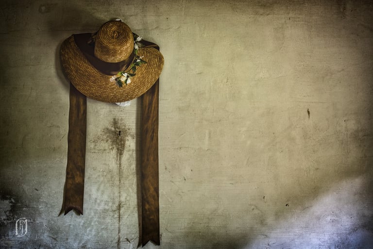 Photo of straw hat on wall