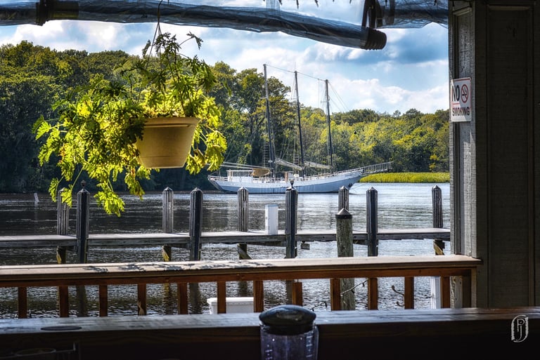 Photo of anchored sailing ship taken out window