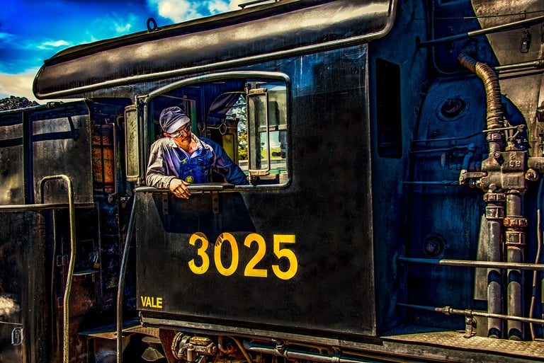 Photo of train engineer in engine window
