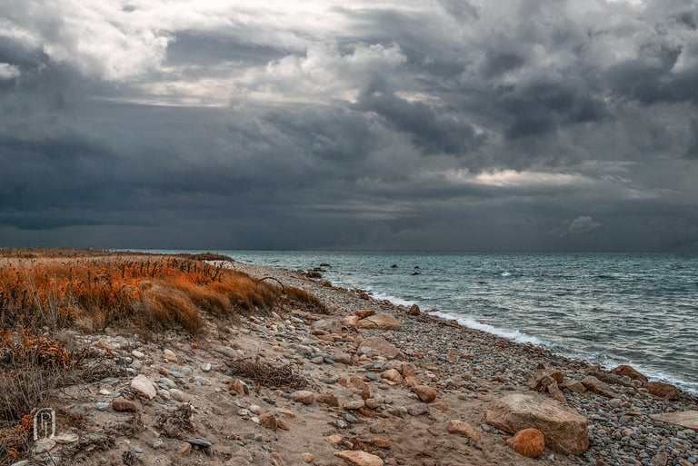 Photo of deserted beach with storm clouds approaching