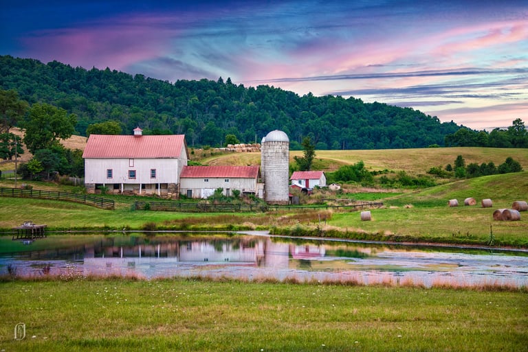 Photo of barn complex in early morning light