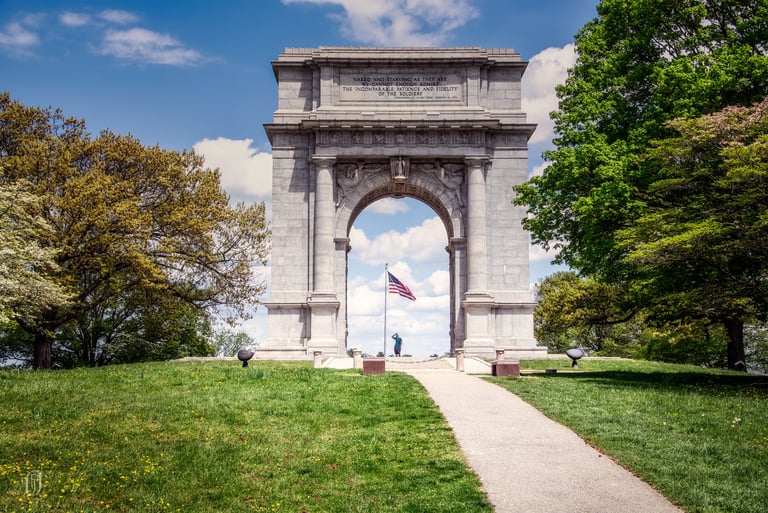 Photo of Revolutionary War memorial with US flag