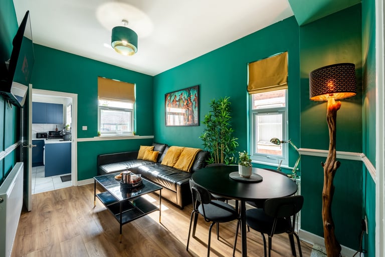 Modern Nottingham apartment living room with Smart TV, sofa and dining area