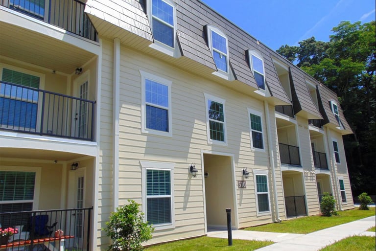 Renovated apartment exterior with new siding at Courtyard Commons in Jamestown NC