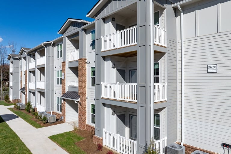 Exterior corridor view showing building alignment and balconies at Evoke Living at Morris Field in Charlotte, NC