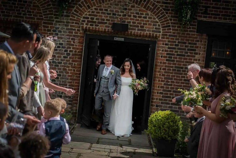 newly-weds stepping outside for their confetti shot