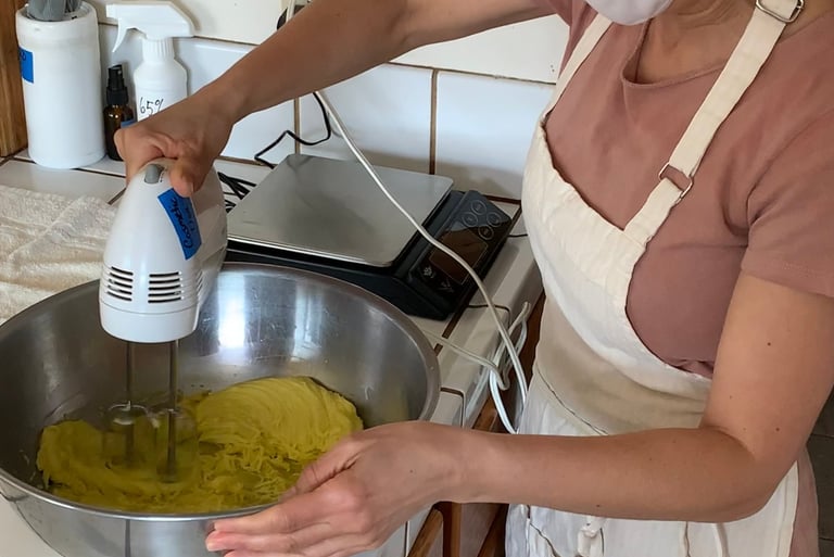 Katrina Matos whipping a bowl of face & body butter