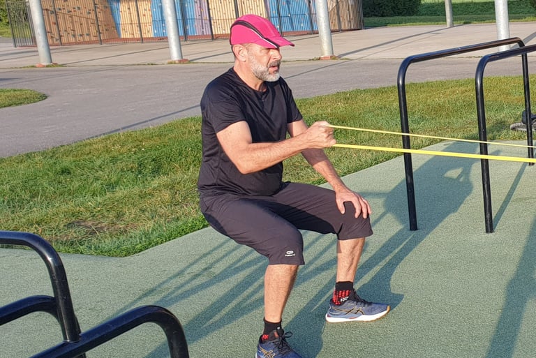 homme squat isométrie élastiques