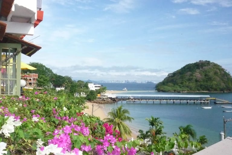 a view of a beach taboga with a boat in the water