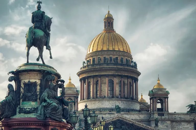 Saint Isaac's Cathedral golden dome behind the bronze equestrian Monument to Nicholas I in Saint Petersburg.
