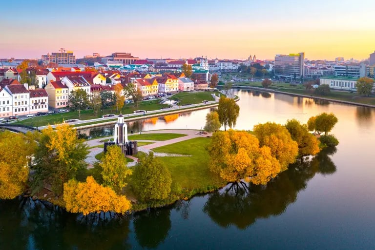 Aerial view of the Island of Tears and Trinity Hill in Minsk, Belarus, during a golden autumn sunset.
