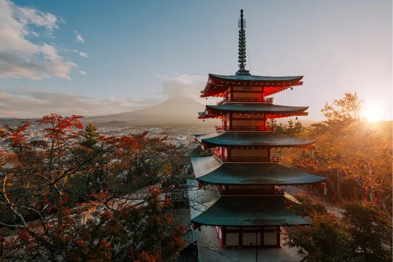 Sunset view of Chureito Pagoda and Mount Fuji with autumn foliage in Japan.