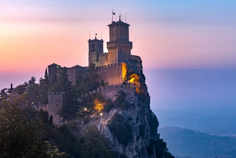 Guaita Tower castle on Mount Titano in San Marino at sunset with panoramic views.