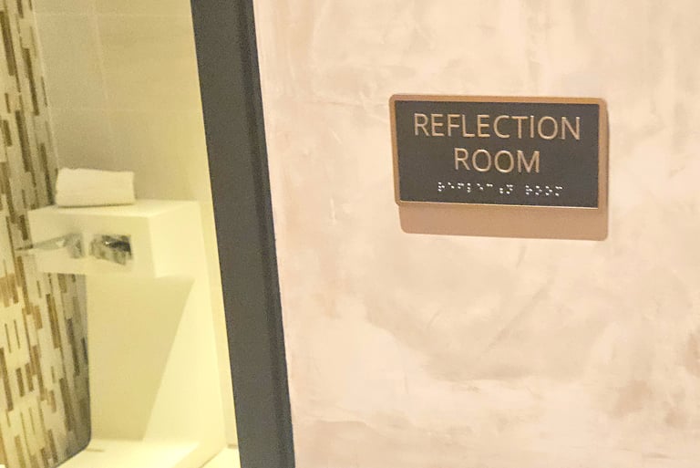 Reflection room sign at Chase Sapphire Lounge JFK Terminal 4 with room entrance visable