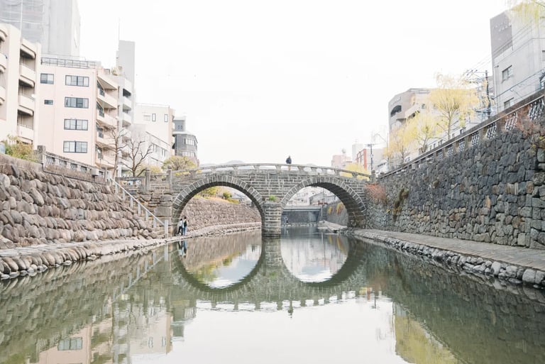 Megane Bridge reflected in the river forming the shape of glasses in Nagasaki