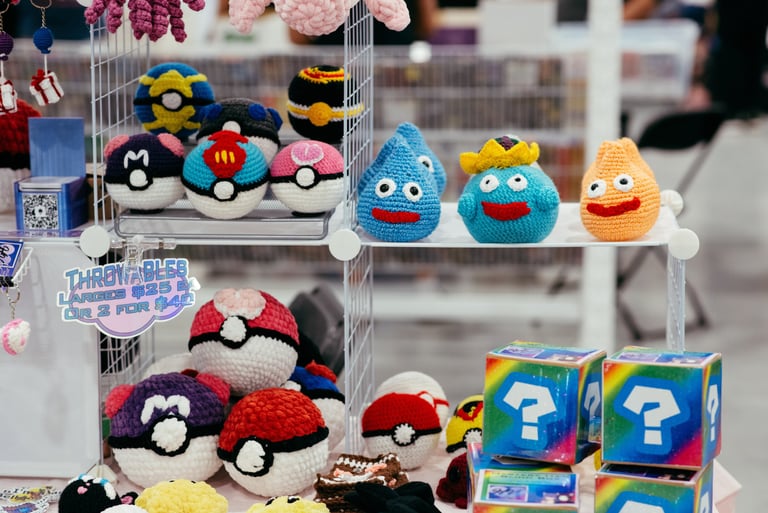 Crochet pokemon characters and poke-balls displayed for sale on shelves