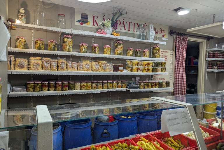 colorful and beautifully arranged homemade pickles in a vendor's display in the Great Market Hall