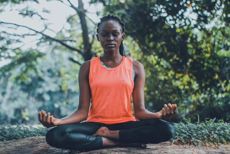 woman reducing stress by meditating