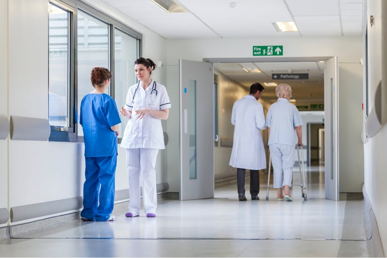  Hospital corridor with nurses and patients, representing healthcare security, staff control, and safe access management.