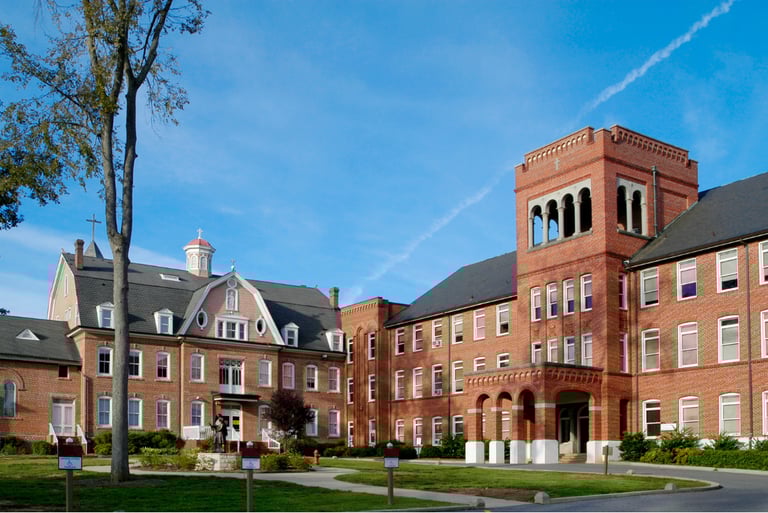 School or university campus with red brick architecture, representing access control and student safety management.