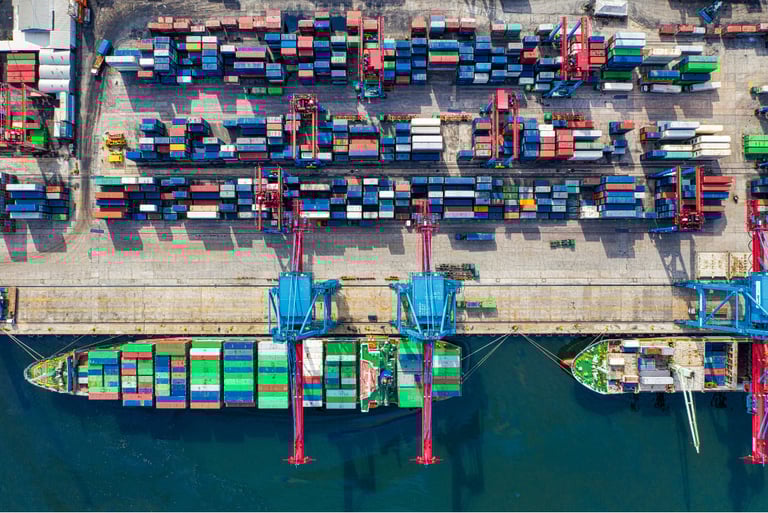 Aerial view of smart seaport container terminal with automated entry systems and infrastructure monitoring using IX.Sentix