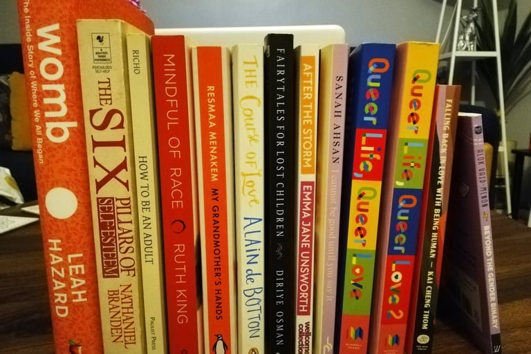 Collection of therapy books, fiction, and non-fiction..