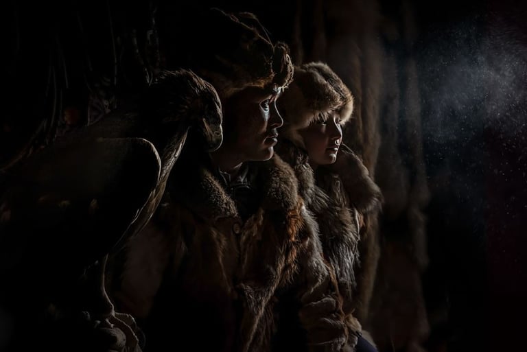 Mongolian eagle hunters in furs in ger