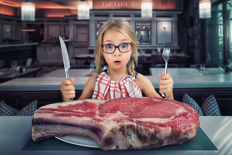 Young girl starting lunch