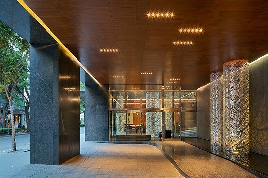 a large building with a long hallway and a large glass door