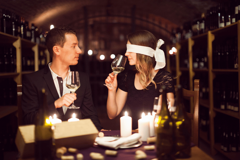 Couple Wine Tasting, female has blindfold on