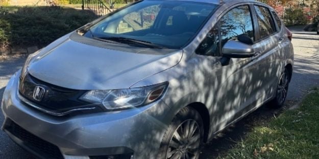 Silver Honda representing Asheville locksmith services including rekeying, ignition repair, and key fob replacement